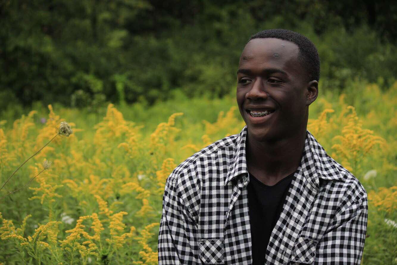 Dalla's senior picture, hard-earned through defeating a language barrier and his own self-imposed limitations. Photo by Tristen Jansheski.