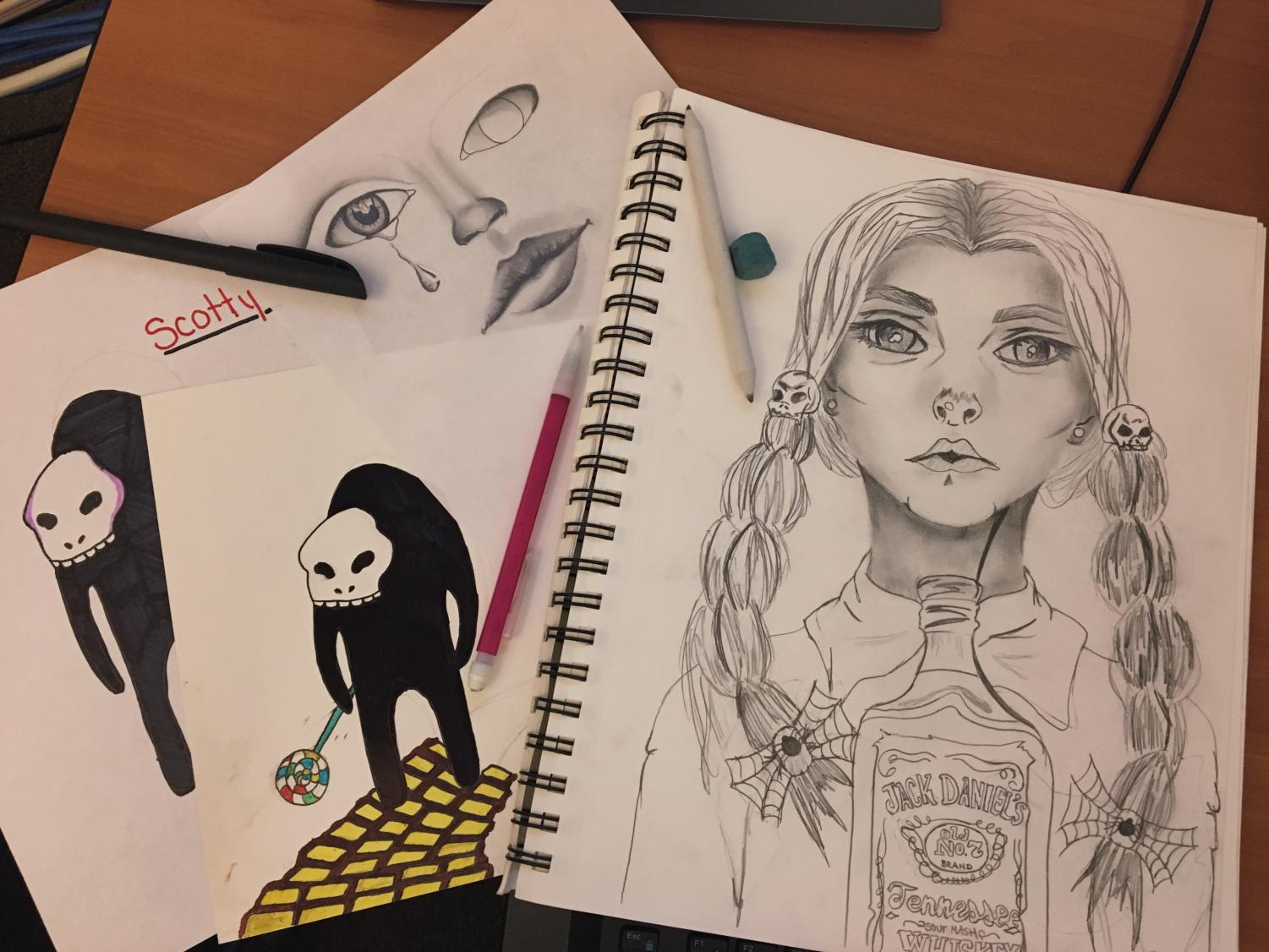 Pictured here are some of Hailee’s artwork. “I mostly like to draw realistic things, especially people,” she said. She was also chosen to draw the illustration for the staff editorial in the first print edition of the Northern Light. Photo by Hailee Clark.