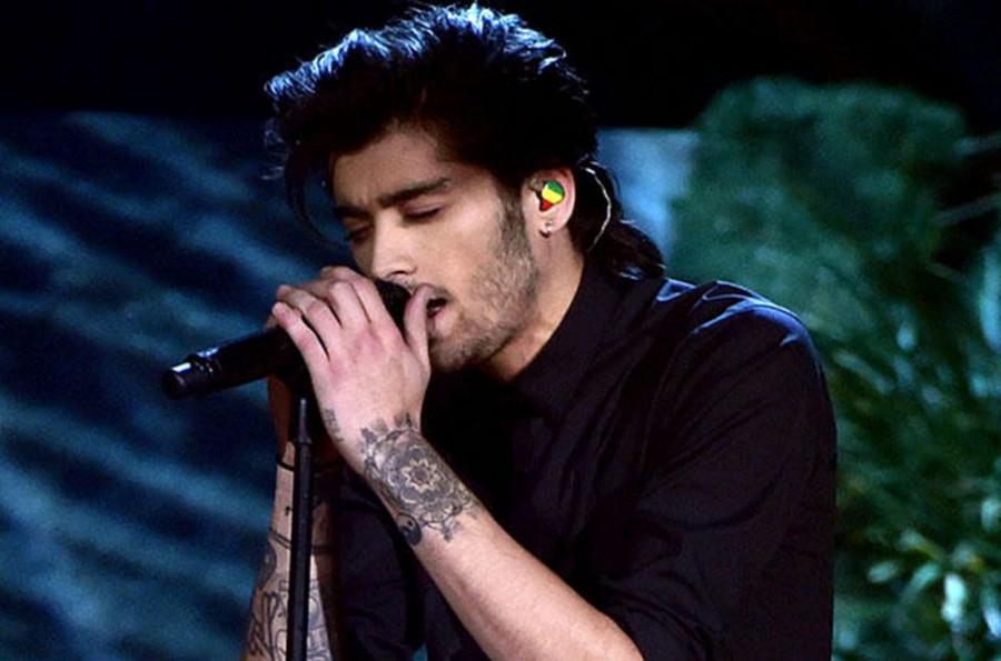 LOS ANGELES, CA - NOVEMBER 23:  Recording artist Zayn Malik of One Direction performs onstage at the 2014 American Music Awards at Nokia Theatre L.A. Live on November 23, 2014 in Los Angeles, California.  (Photo by Kevin Winter/Getty Images)