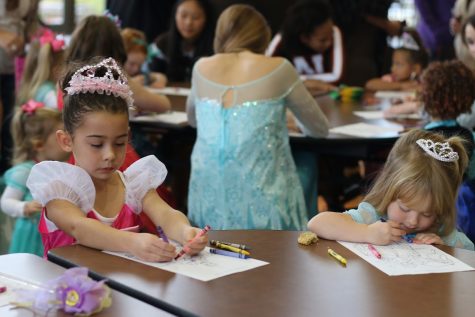 Tiny princesses color pictures at last year's princess tea party. 