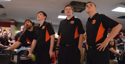 The bowling team keeps an eye on the scoreboard at the state tournament. They finished in 11th place. 