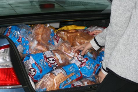 Bread is stuffed into the truck so students can start lifting as much as possible.
