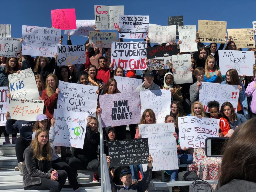 Students made more posters than for the last protest, and their organized events were held in the new bleachers at Huskie Stadium. Photo by Lily Antor. 