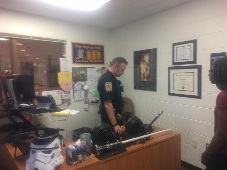 School Resource Officer Nate Slavin in his office command center, where he closely monitored the event and made the determination to initiate the precautionary lock-up for student safety.