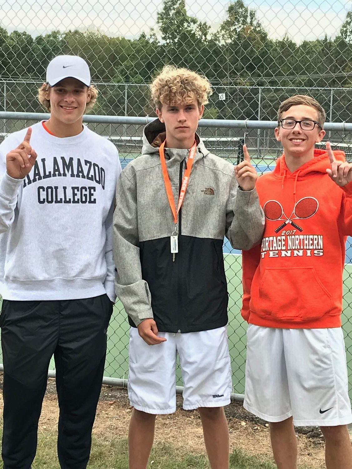 Jackson Graham, Graham Holley, and Keegan Bach celebrate after they win their flights at the SMAC tournament. Photo by Becky Bach