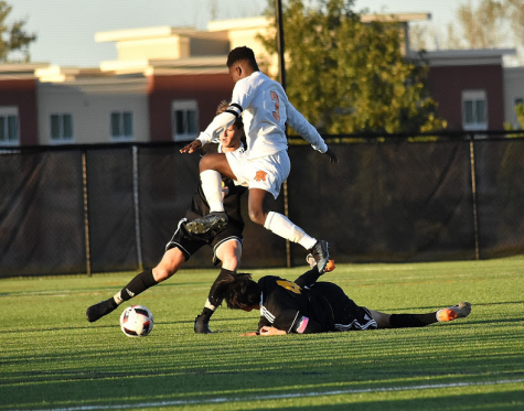 Junior midfielder Levi Crooks leaps over a PC defender in the first round of the league tournament. The Huskies lost 1-0, despite controlling play for most of the game. The Mustangs went on to win the tournament, and PN came in third. Photo courtesy of Portage Central parent photographers. 