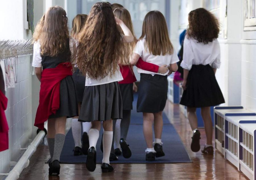 School uniforms would erase the need for a dress code and help all students focus more.