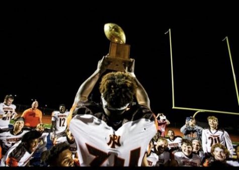 Anthony hoists the Kavanaugh trophy after PNs victory over PC in 2019.