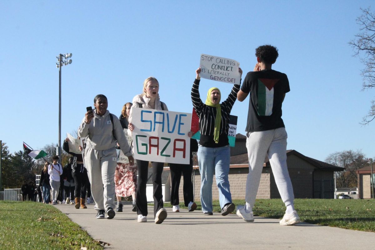 Junior Aisha Siddiqui marches down Oregon Ave. during the November 9 protest. 