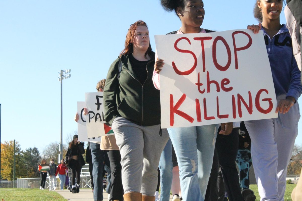 Juniors Neajai Lewis and Emerson Gillam-Shaffer walk to protest the violence happening in Gaza. 