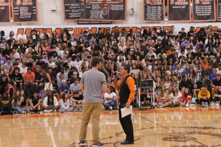 Joey Wood enlists the help of new English teacher Bill Lapham, who joined the staff from North Middle School, for help demonstrating how the staff game works. 