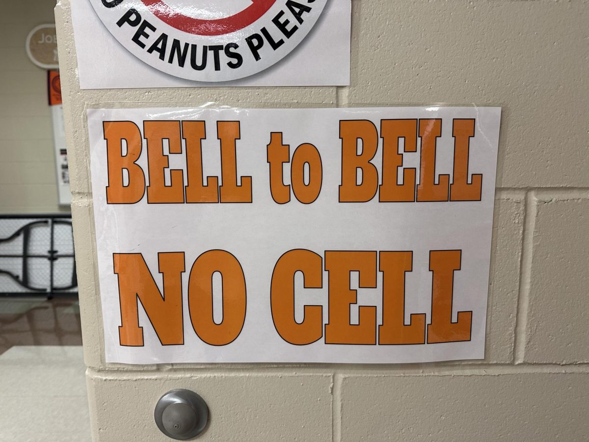 This sign is displayed in the art room to clearly communicate the new cell phone policies. 