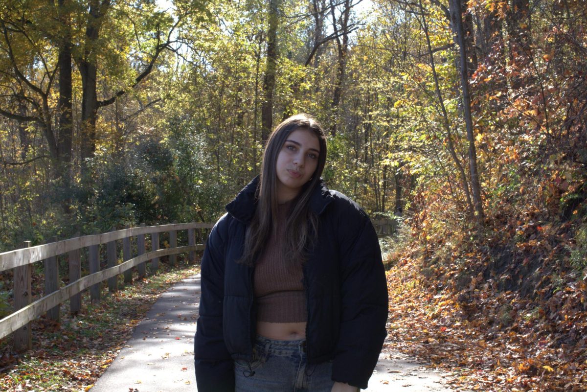 Carpenter poses in the woods for her senior pictures. Photo Courtesy of Monica Norman