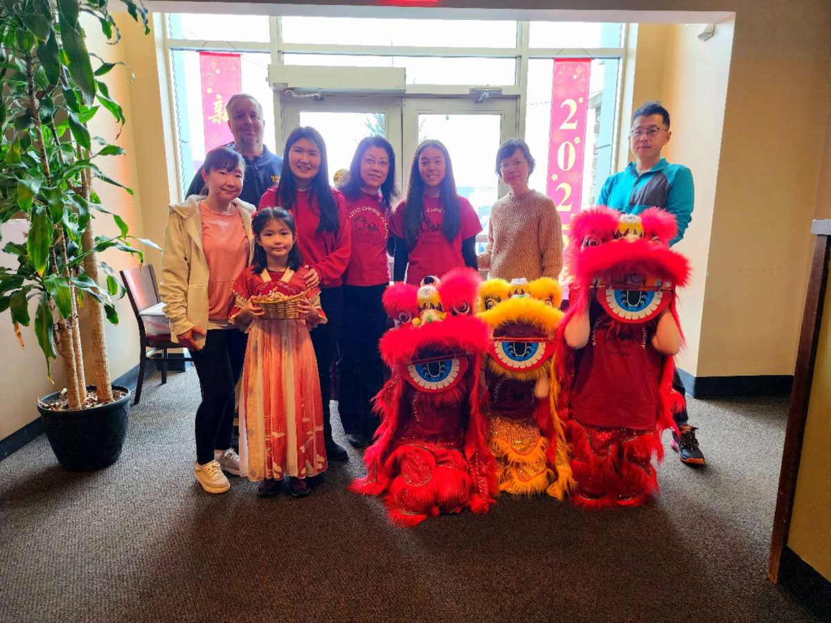 Junior Eliza Yuan (center) celebrates Chinese New Year at Hunan Gardens in 2025 with a group of friends from the Kalamazoo Chinese Academy, the dance studio Yuan performs at. “It is important to celebrate Chinese New Year with my friends and family because it makes connections between us stronger,” Yuan shared. “We can all embrace our culture.” Photo courtesy of Eliza Yuan. 