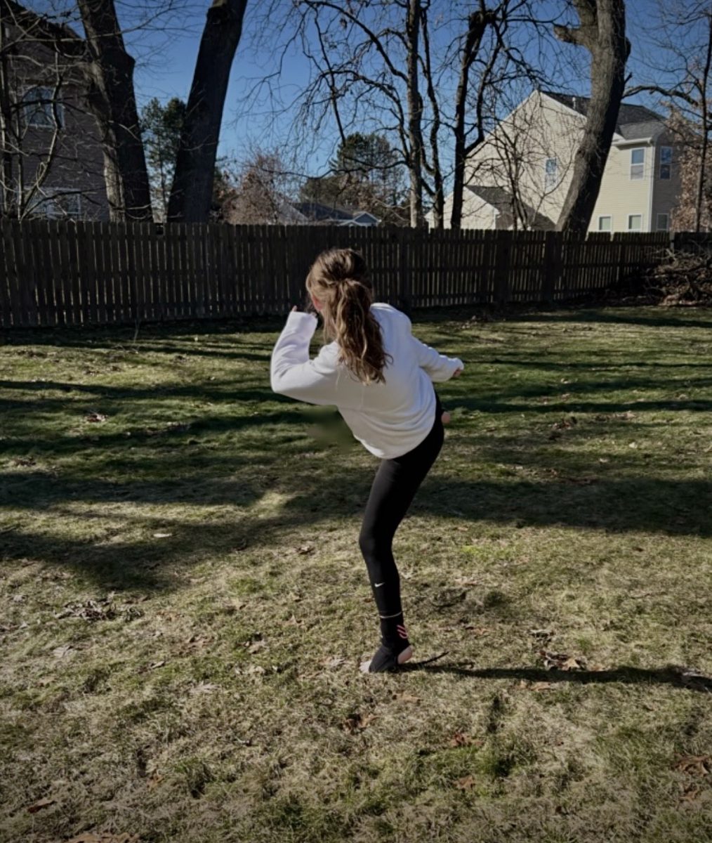 Journalist Kenna Hulick trains her martial arts skills in the backyard of her house. Photo courtesy of Angela Hulick.