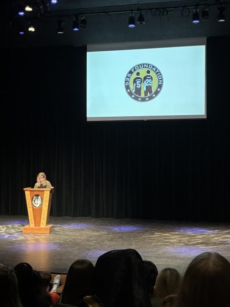 Becky Savage, co-founder of the 525 Foundation, shares her story in a presentation for NHS and NMS students on March 10, 2026. 
