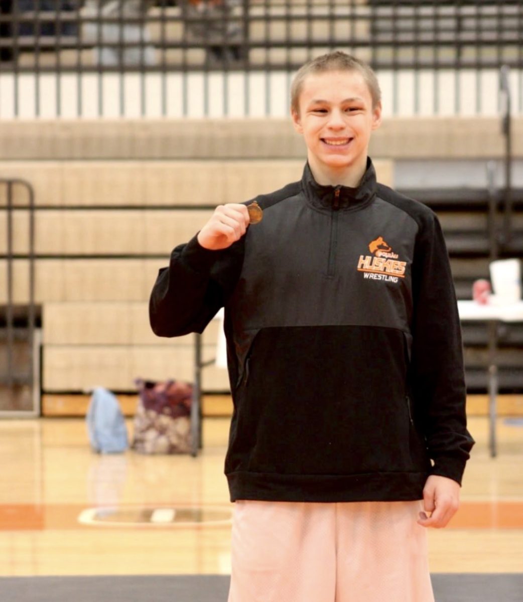 PN wrestler Jordan Barnhart smiles as he holds a 3rd place medal from a wrestling match. Photo courtesy of Jordan Barnhart.